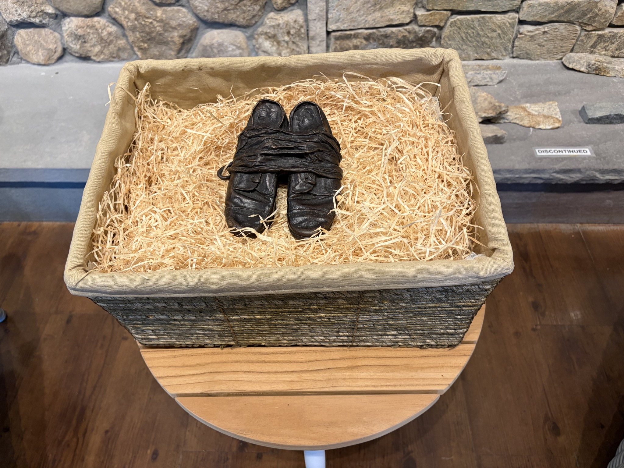 Bronze children’s shoes on display at the launch reception